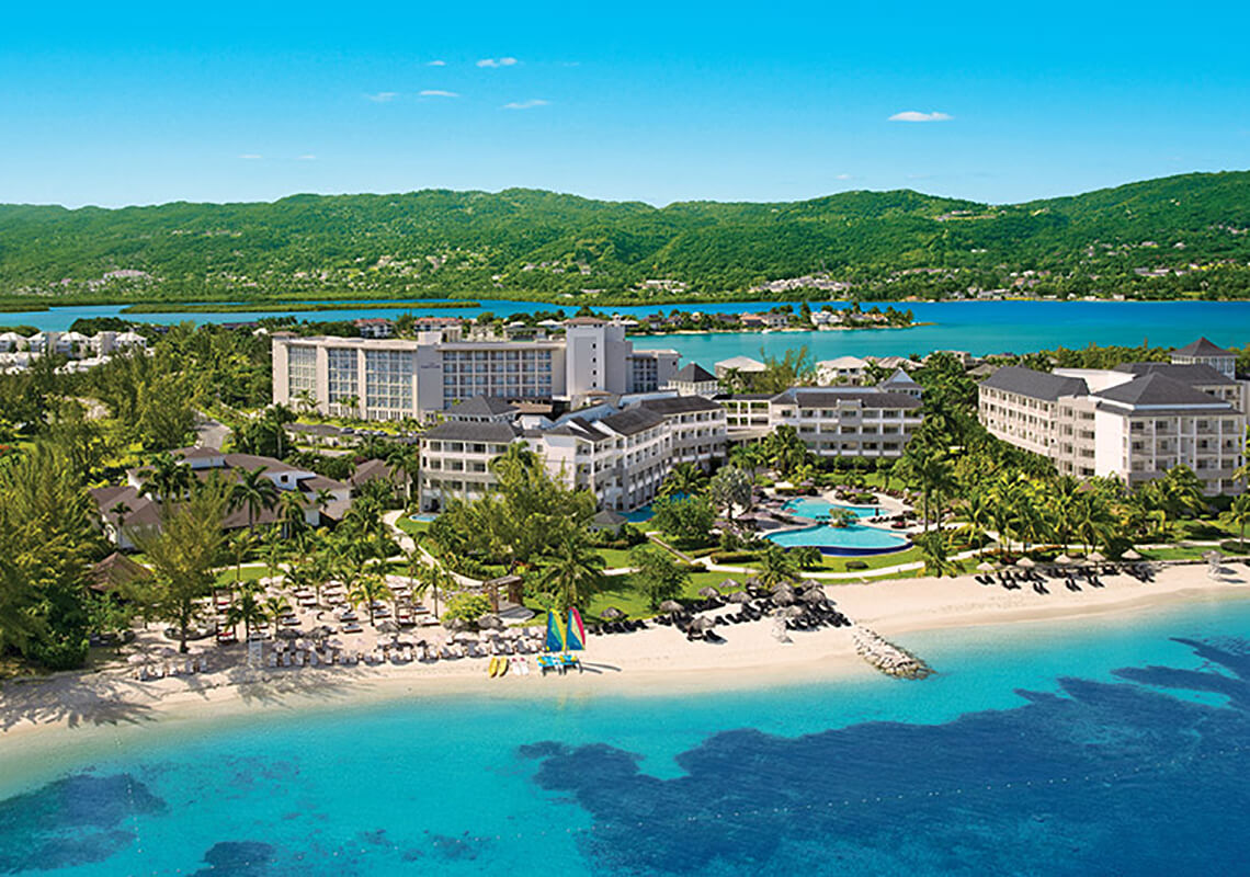 Breathless Montego Bay adults-only all-inclusive resort in Jamaica with vibrant pool scene, oceanfront views, and high-energy social atmosphere.