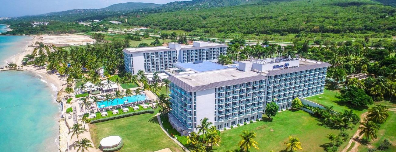 Hilton Rose Hall Resort and Spa all-inclusive family resort in Jamaica with waterpark, beachfront pools, and tropical gardens in Montego Bay.