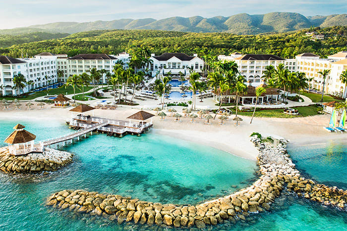 Hyatt Zilara Rose Hall adults-only all-inclusive resort in Jamaica with beachfront pools, modern luxury design, and Rose Hall mountain views.