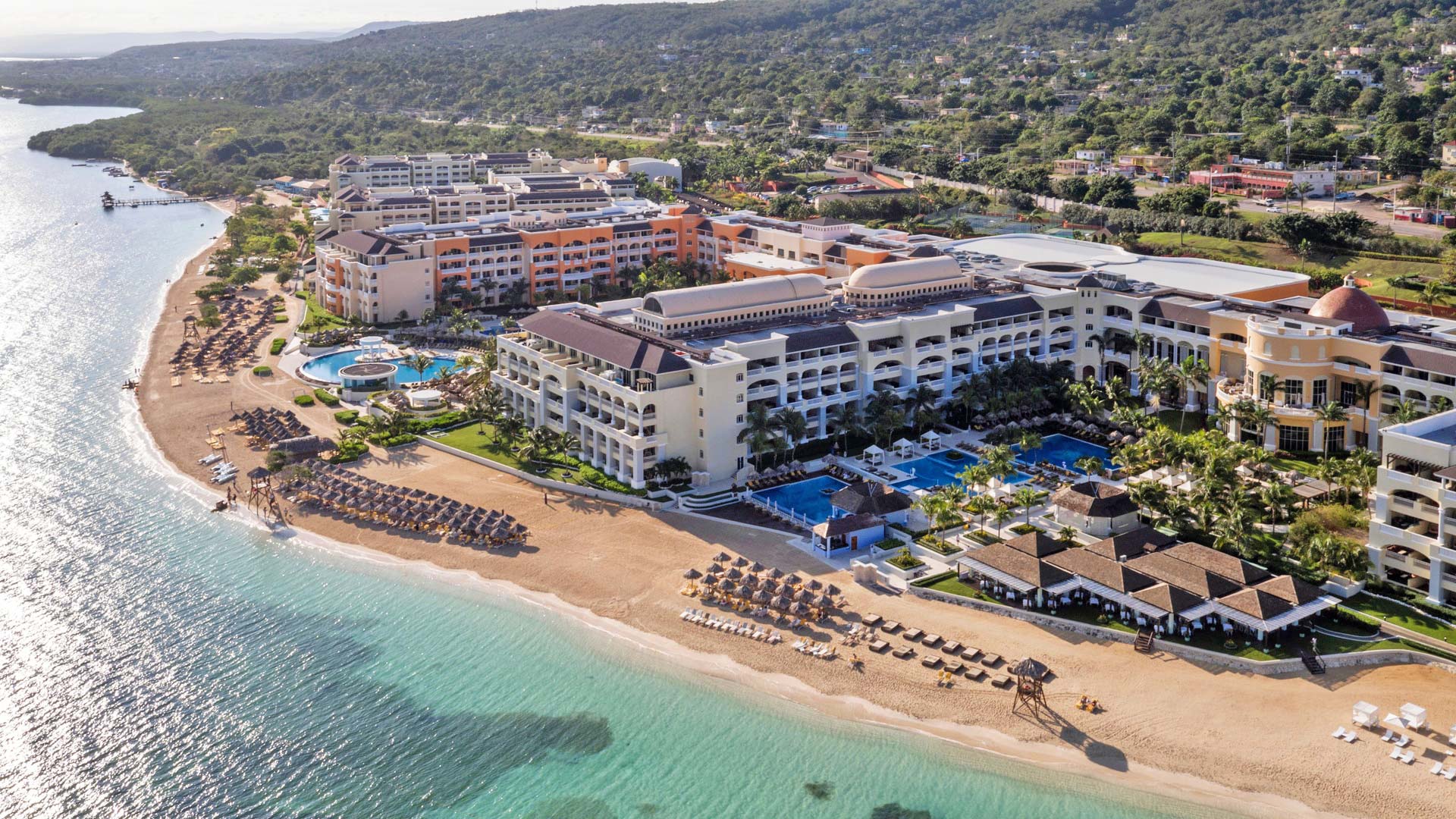 Iberostar Selection Rose Hall Suites family-friendly all-inclusive resort in Jamaica with oceanfront pools, lush gardens, and beachfront access.
