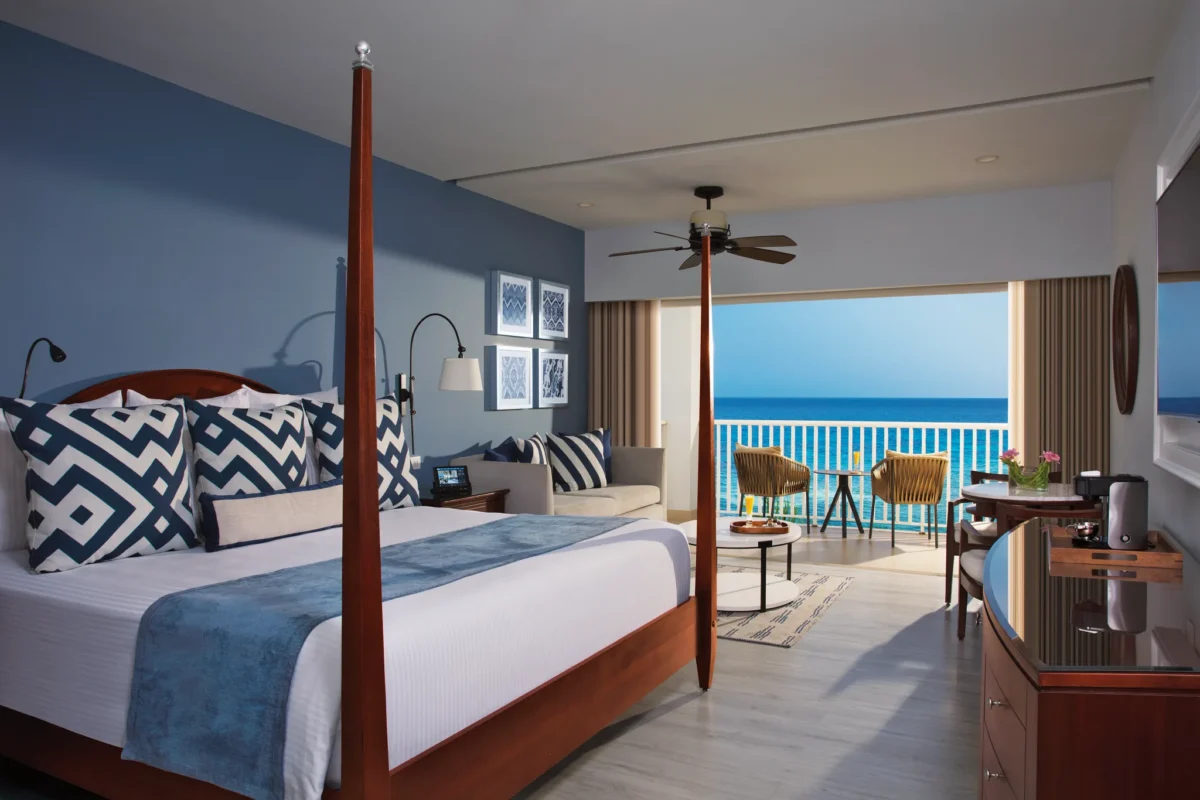 Junior Suite Ocean Front with king bed and private balcony overlooking the Caribbean Sea at Secrets St. James Montego Bay.