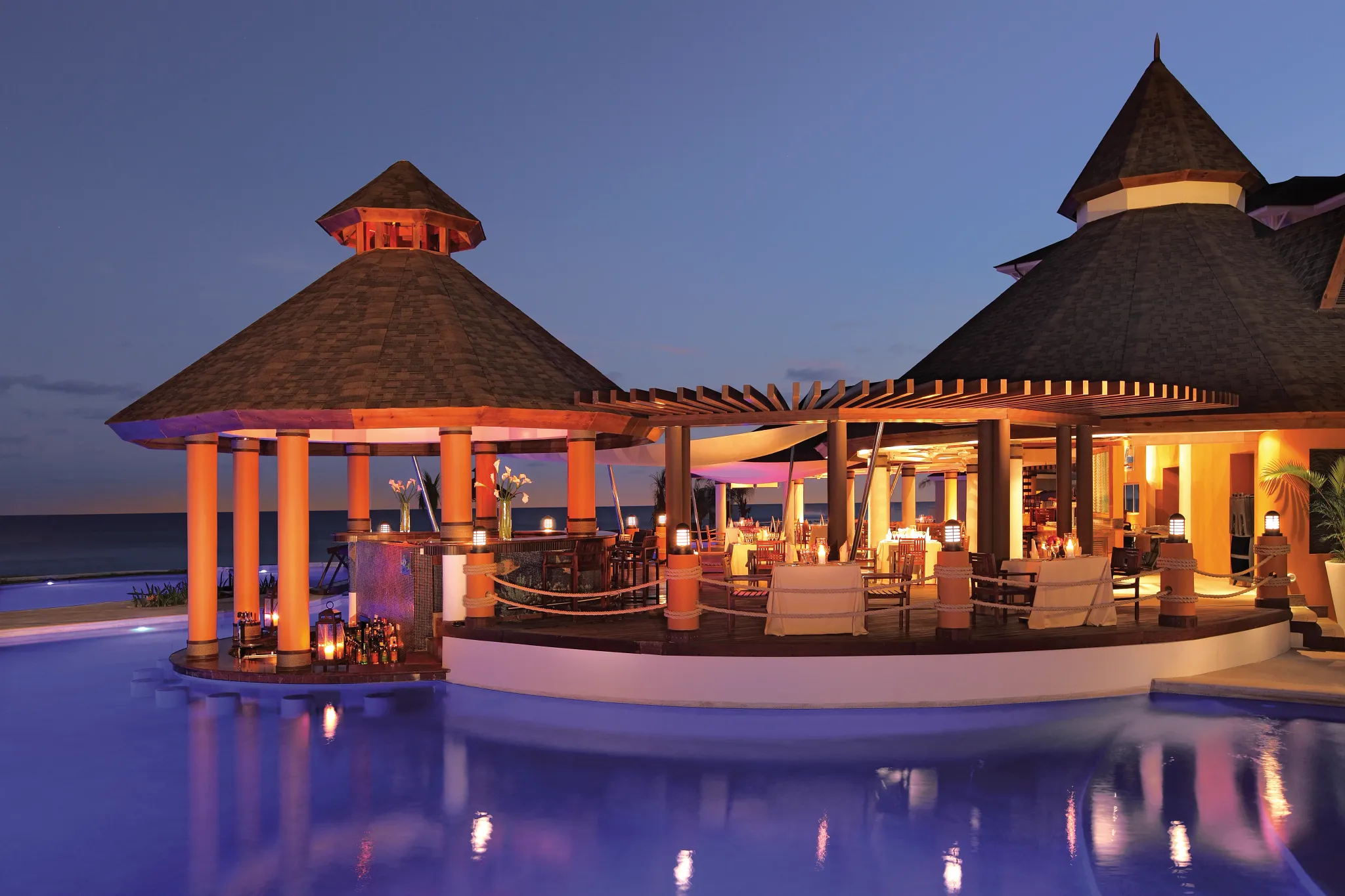 Oceana seafood restaurant at Secrets St. James Montego Bay featuring oceanfront dining with elegant tables, sunset views, and fresh seafood dishes.