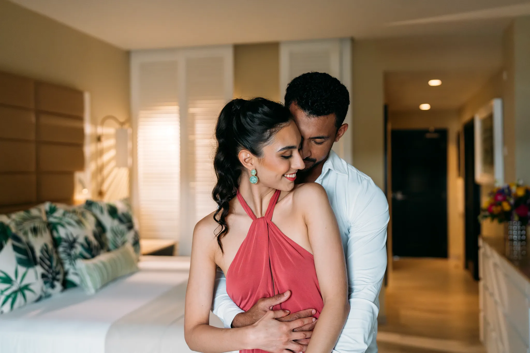 Couple embracing in a romantic luxury suite at Secrets St. James Montego Bay, ideal for couples and honeymoon stays.