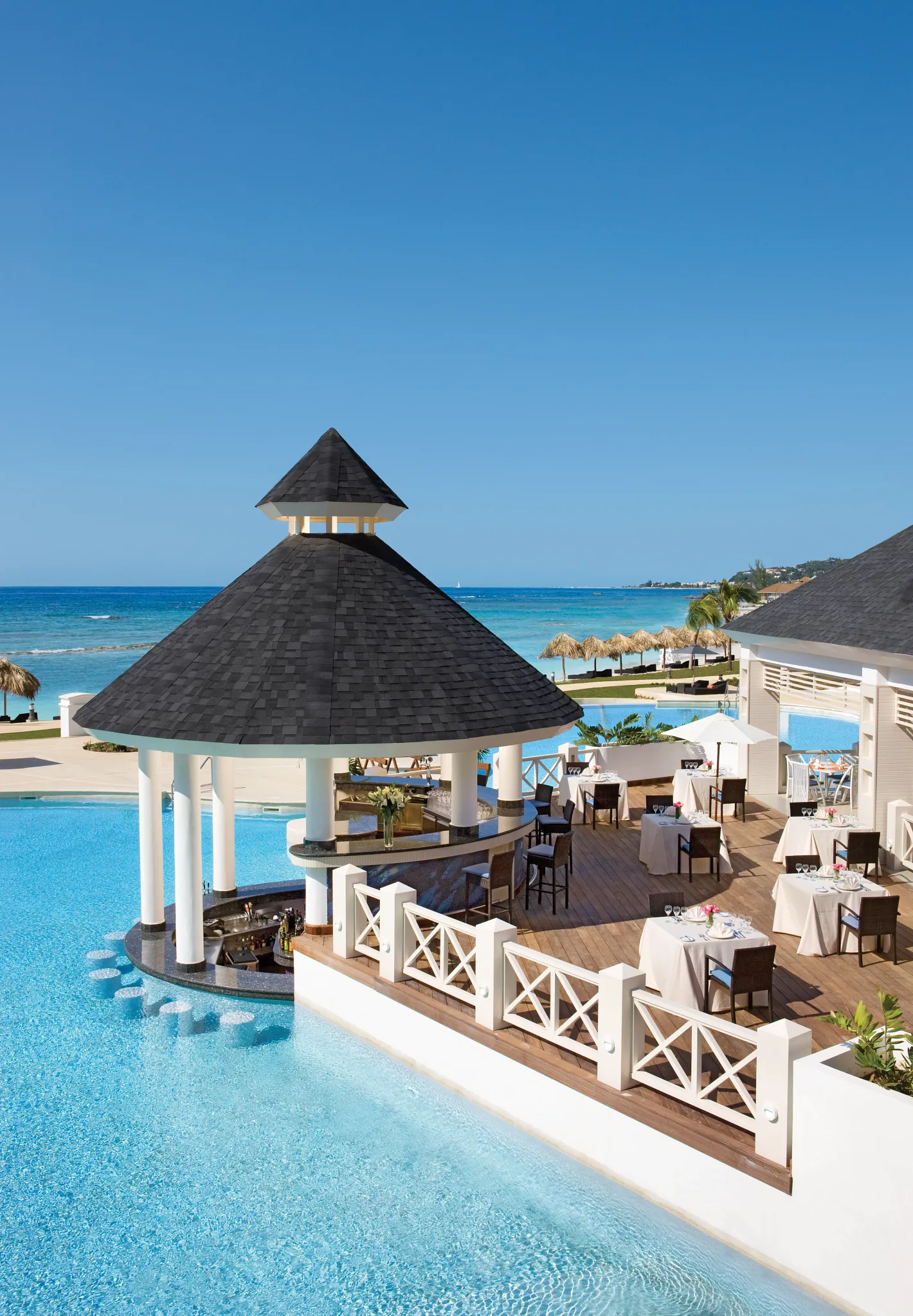 Seaside Grill at Secrets St. James Montego Bay featuring open-air poolside dining with ocean views and grilled specialties.